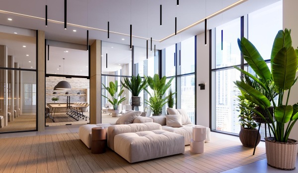 a spacious, well-lit room with a large glass window and a white couch