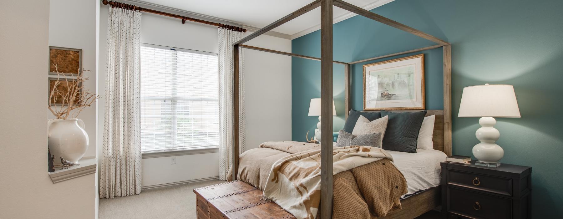a bedroom with a bed and a fan