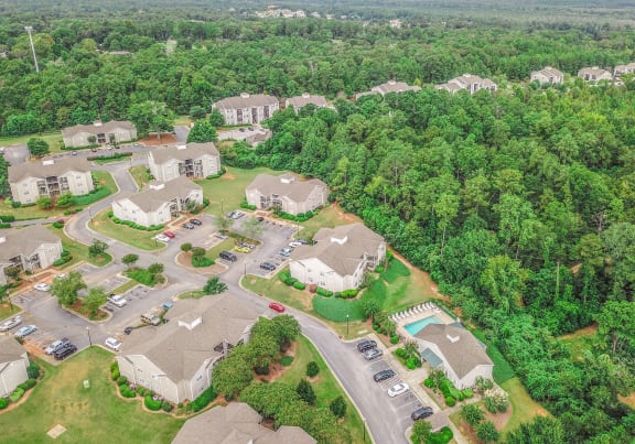 arial view of a neighborhood with houses and trees