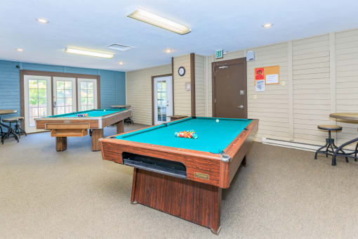 a game room with two pool tables and two billiards at Lincoln Village Apartments, Spokane, WA