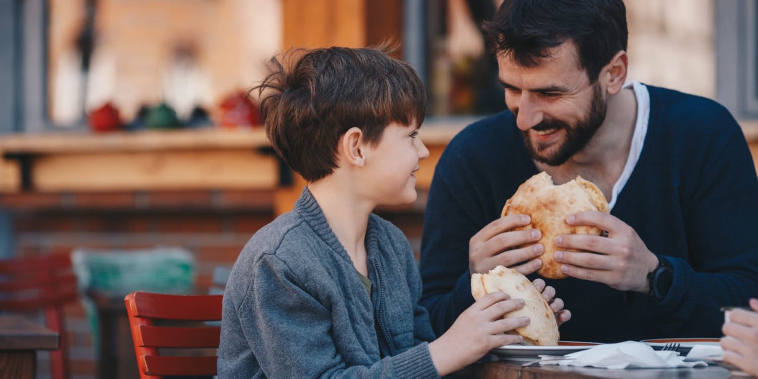 A resident and his son getting a meal near Burrell Square in Rome, Georgia