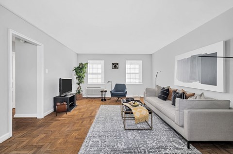 a living room with a couch and a tv