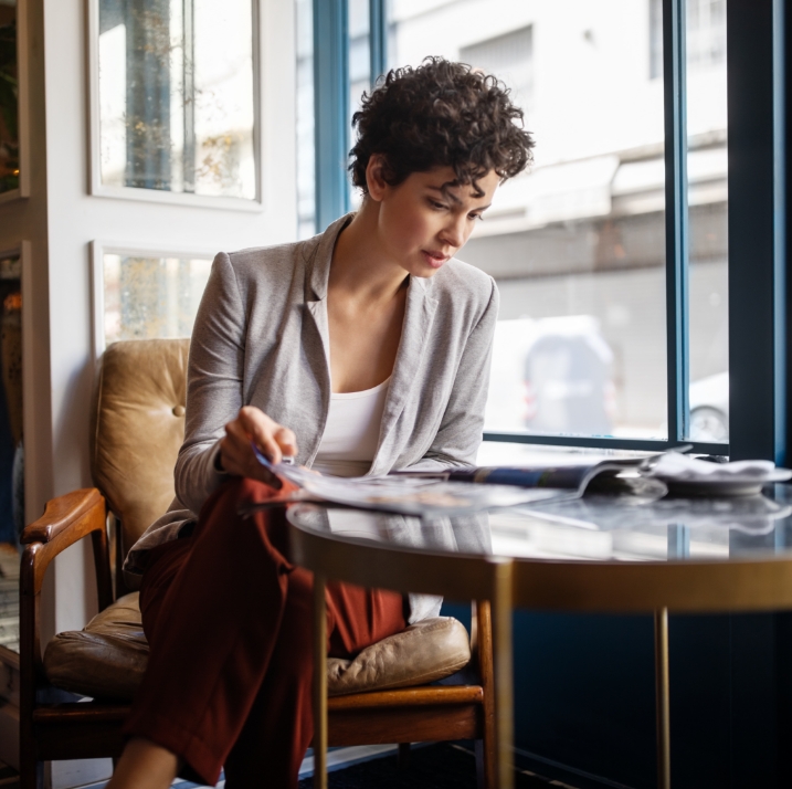 woman reading newspaper