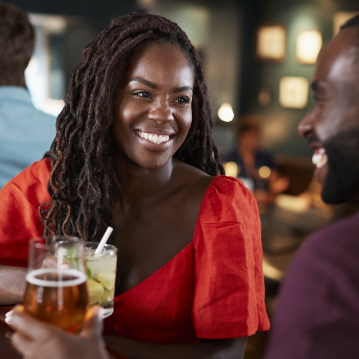 girl smiling with drink