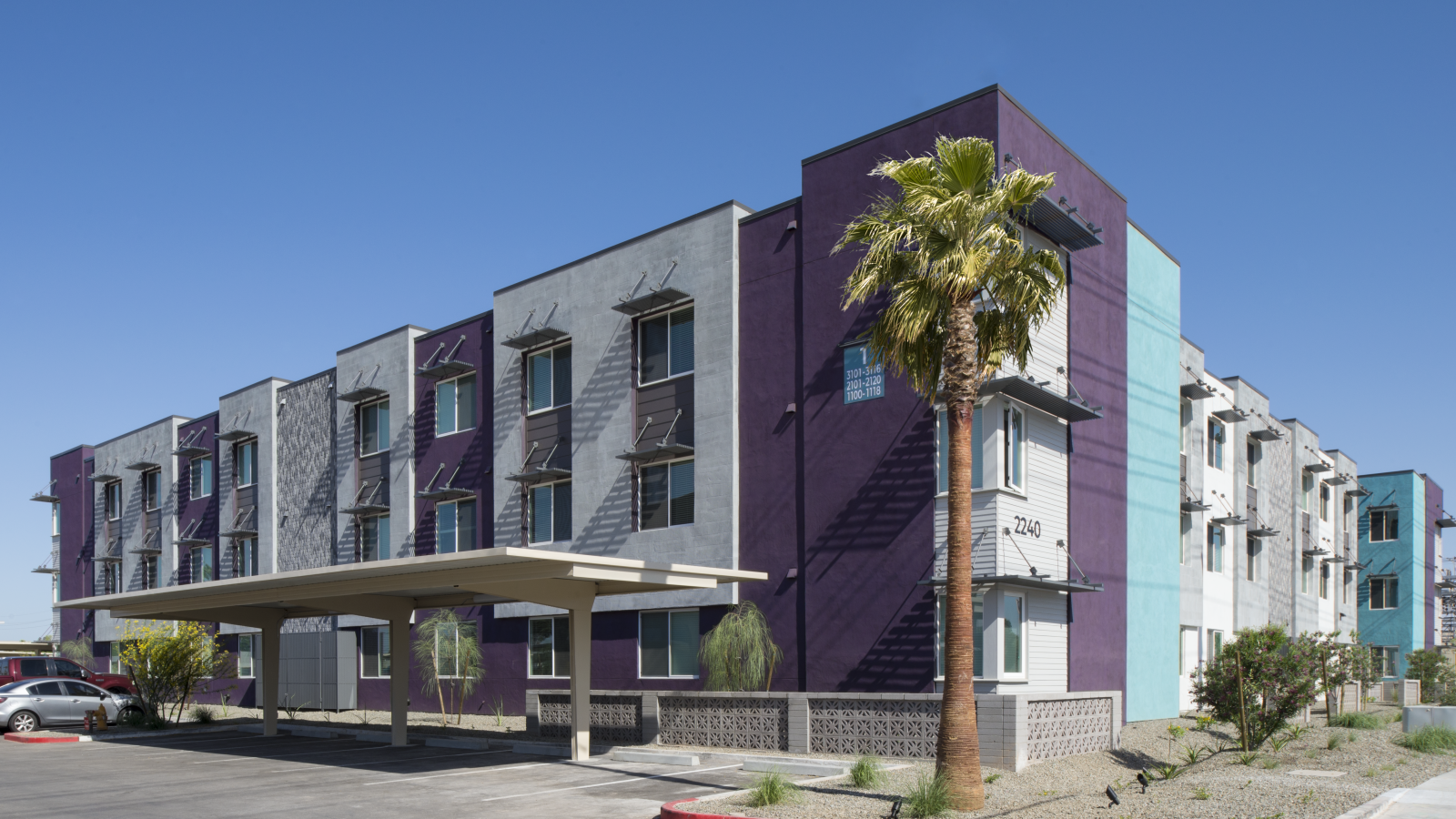 Stylish modern residential complex exterior highlighting Scottsdale apartment floor plans.