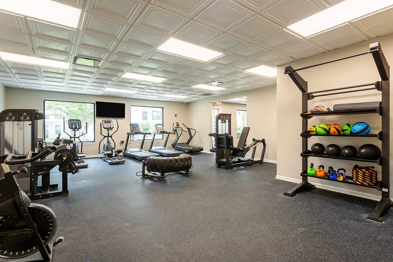 Fitness center with free weights and cardio equipment