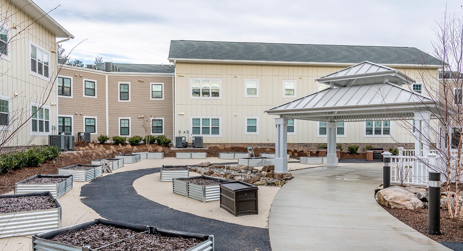 Landscaped courtyard with community garden at The Fallstead