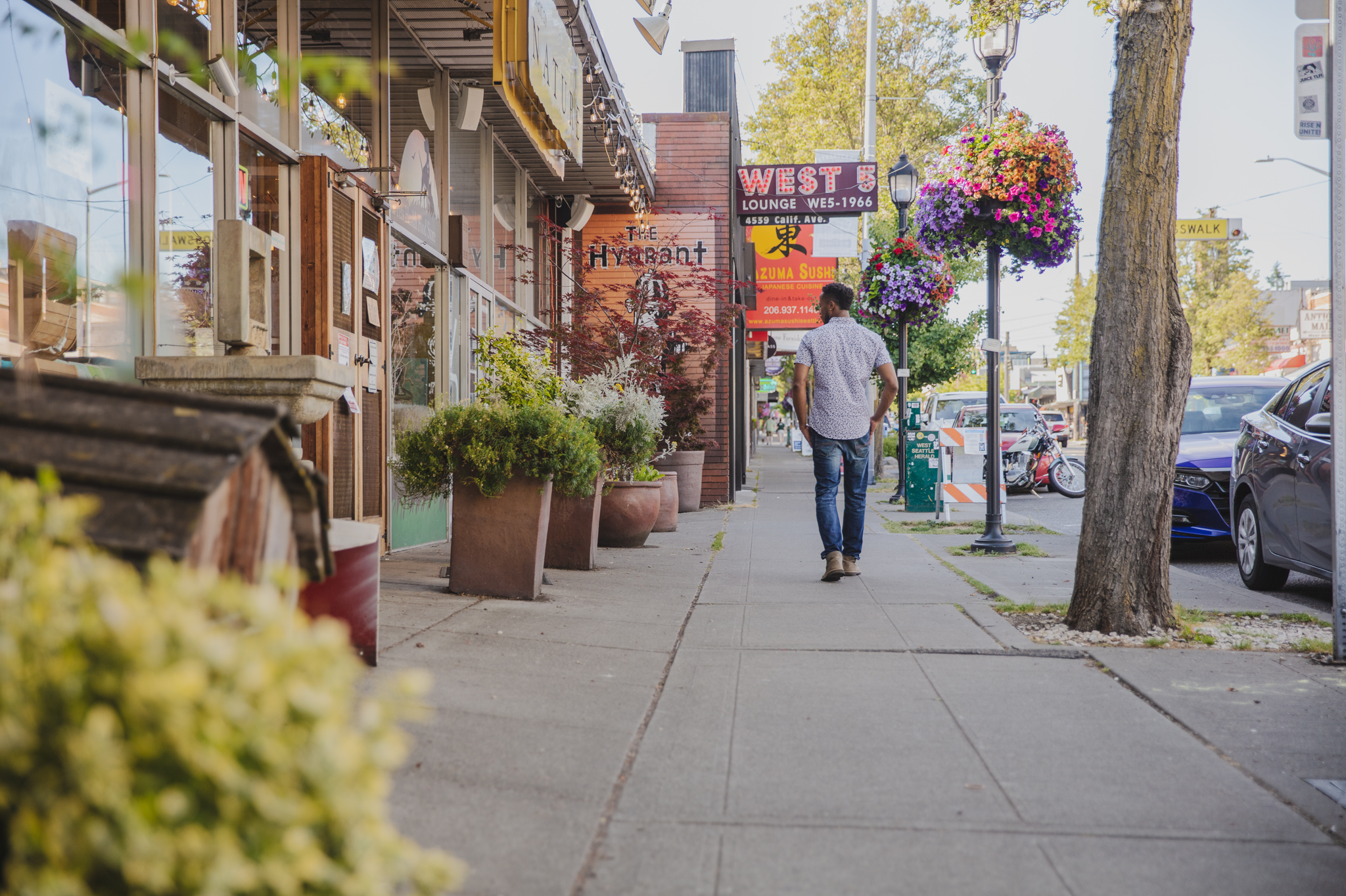 Maris Seattle person walking down the neighborhood street