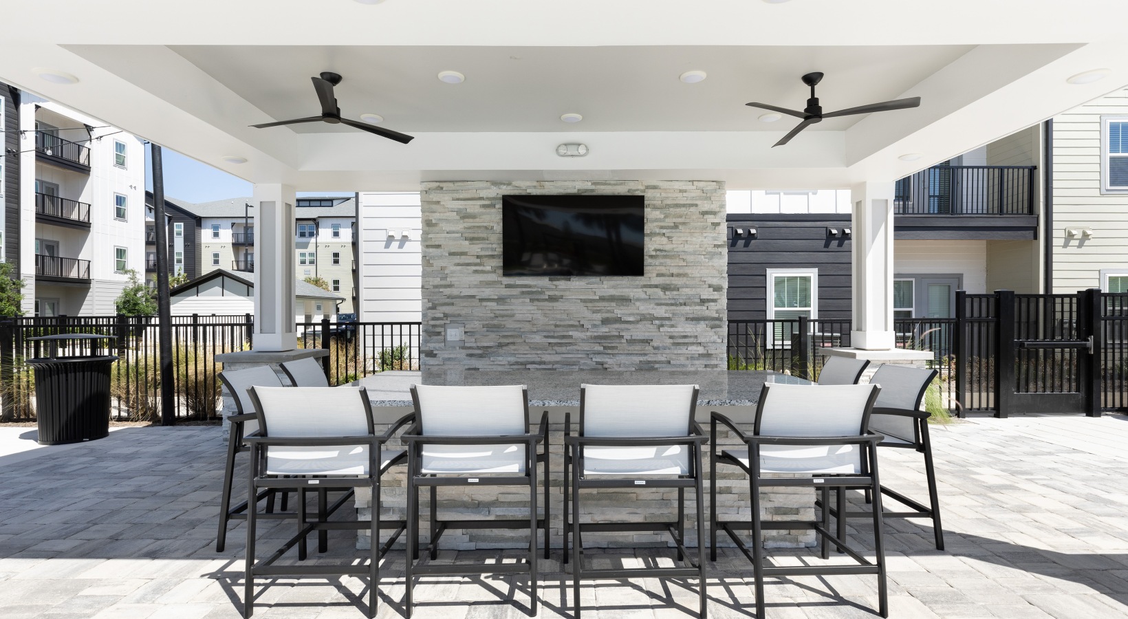 Outdoor seating and relaxation area at Madison Waterstar apartments near Sunset Walk Kissimmee.