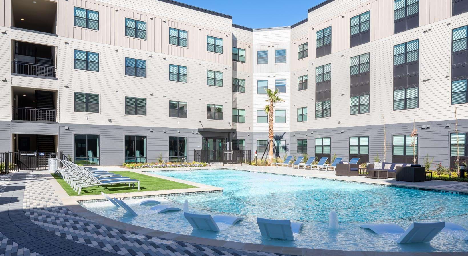 a pool in front of a building
