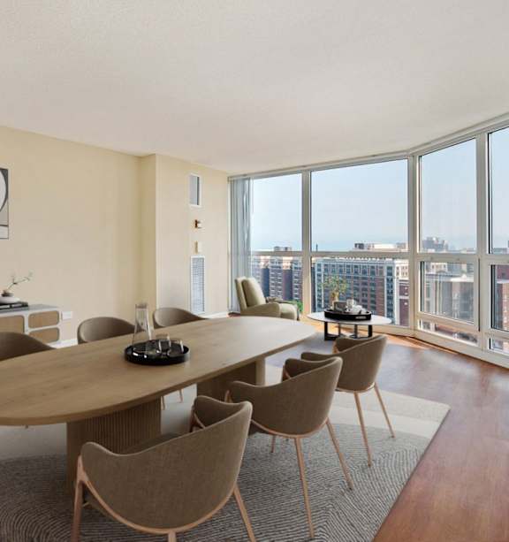 A modern dining room with a large table and chairs.