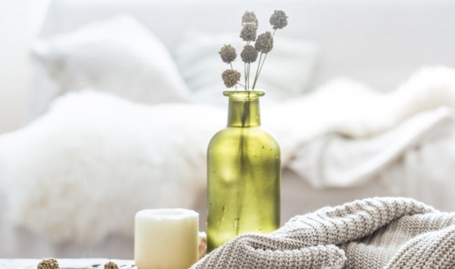 a bottle of oil and a candle