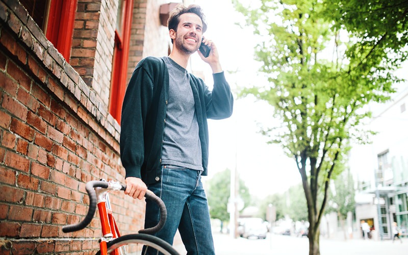 Man holding bike in the city