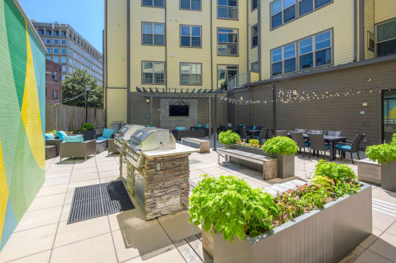 Private courtyard with fire pit and outdoor grills