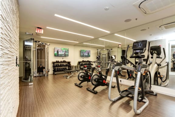 a room filled with lots of different types of exercise equipment