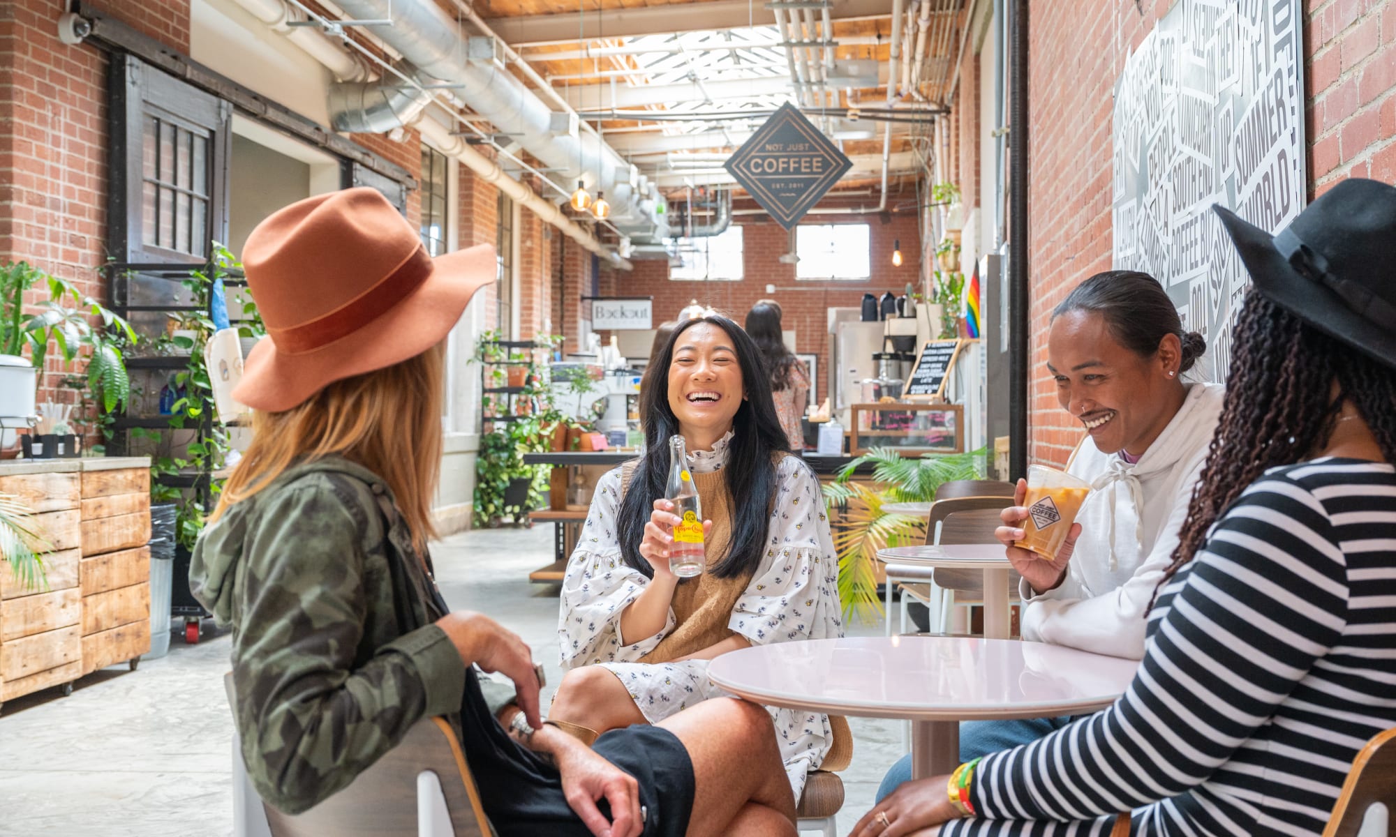 Residents having a drink at a local shop near at Raven South End in Charlotte, North Carolina