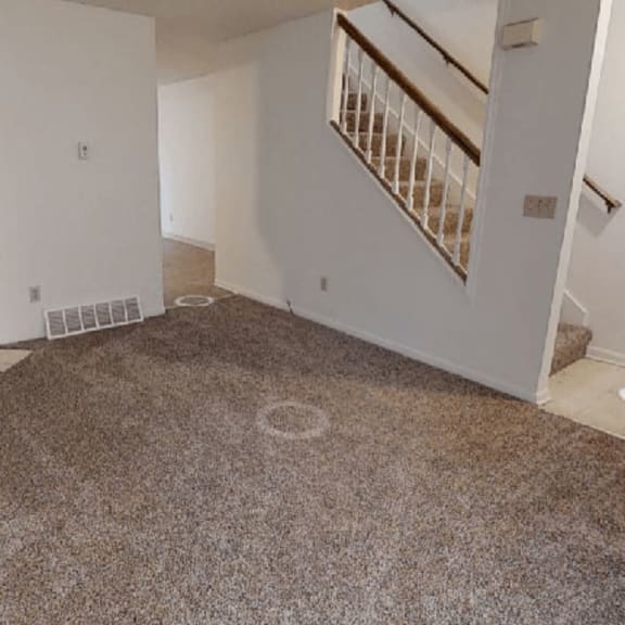 Thumbnail 3 of 6 Living Room with Fireplace at Arbor Pointe Townhomes, Michigan
