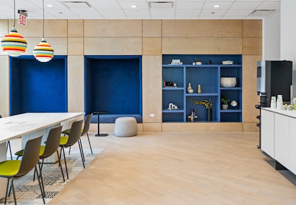 A conference room with a long table and chairs.