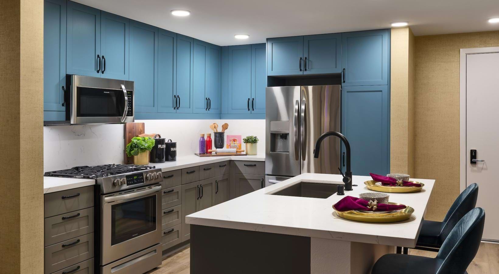 a kitchen with blue cabinets