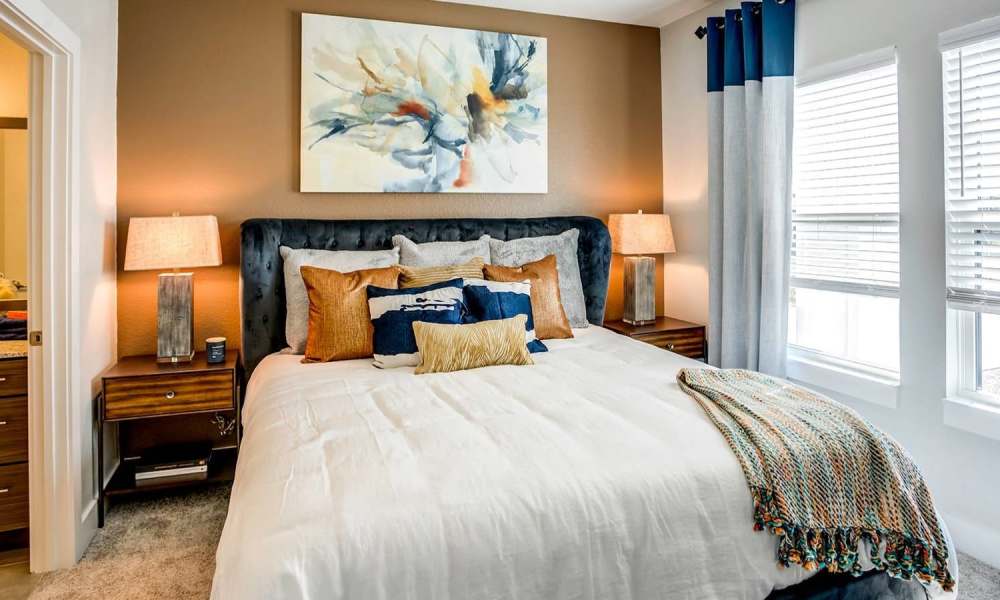 Bedroom with two side lamps at Wildgrass in Riverview, Florida