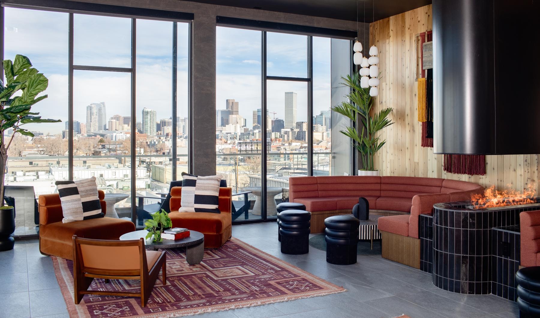 a room with a fireplace and chairs