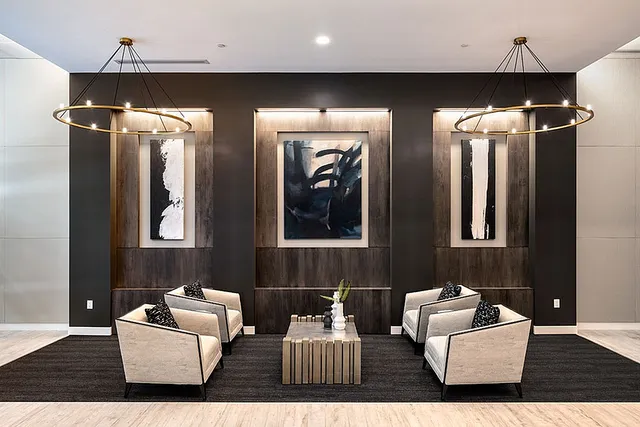Elegant lobby with modern artwork, chic chairs, and stylish lighting.