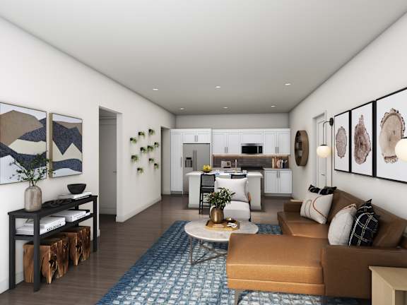 A modern living room with a brown sofa and a coffee table.