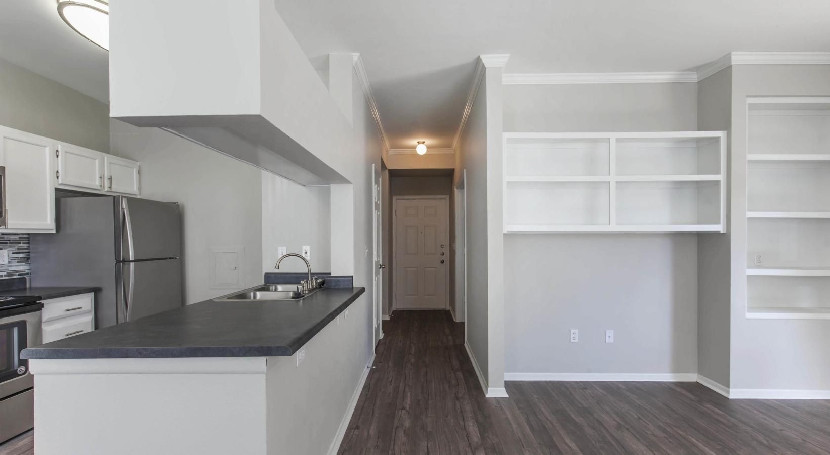 a kitchen with white cabinets