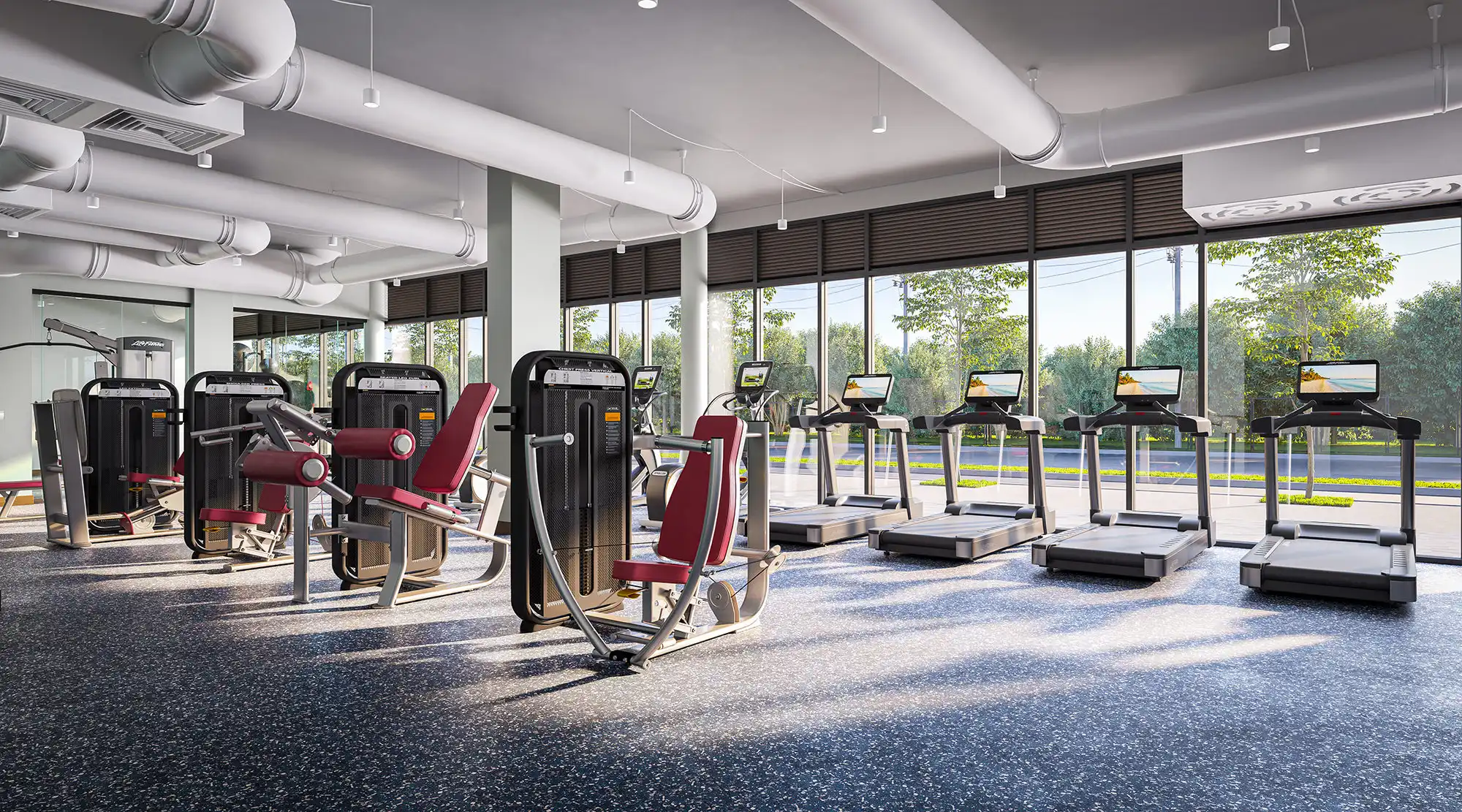 Alternate view of the fitness center at Perla's luxury Tallahassee, FL, student apartments near the FSU campus, showing cardio equipment and weight machines