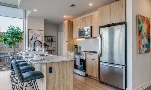 Kitchen with Stainless Steel Appliances in Our Apartments by the Katy Trail in Dallas, TX