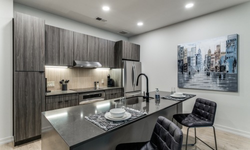 Kitchen with Sleek Countertops in Our Apartments Near West Village