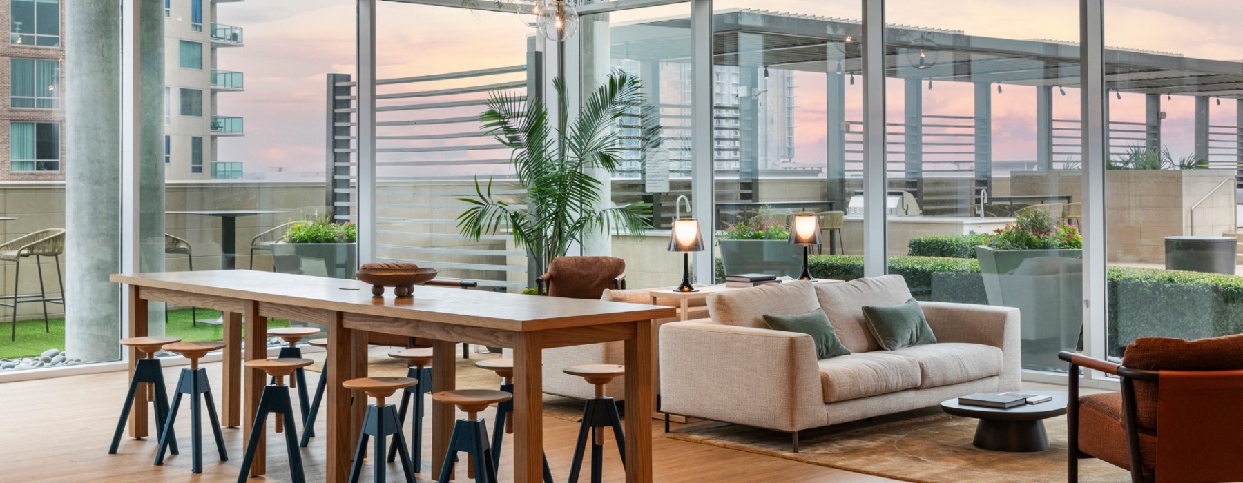 Upscale Lounge with Views of the Outdoor Kitchen at Our McKinney, Uptown Apartments in Dallas, TX
