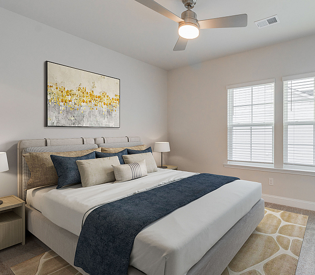 Bright and inviting bedroom with contemporary decor, featuring a plush bed, modern artwork, and large windows for abundant natural light.