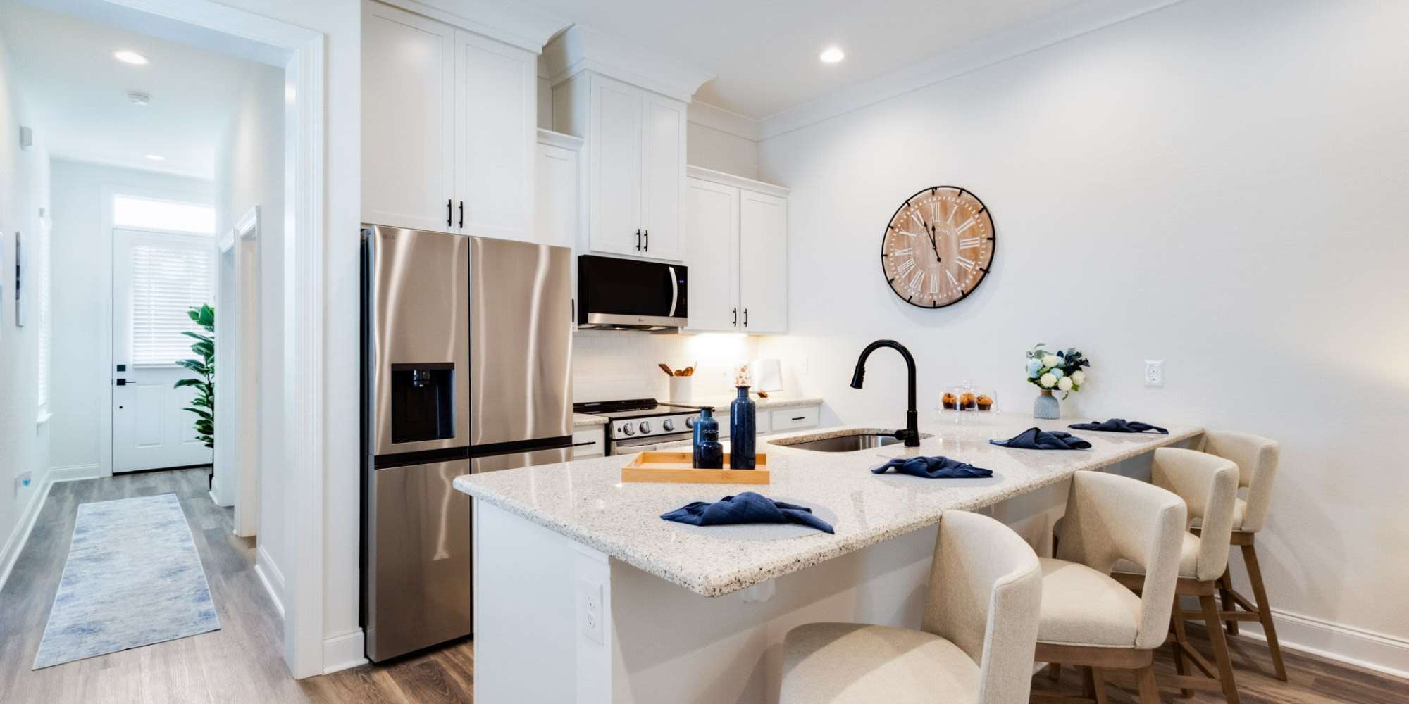 Modern kitchen appliances with white cabinets at Trinity Villas in Lafayette, Louisiana