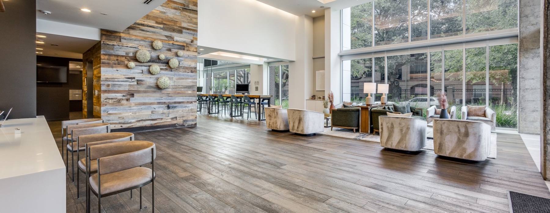 a spacious clubroom with tall windows