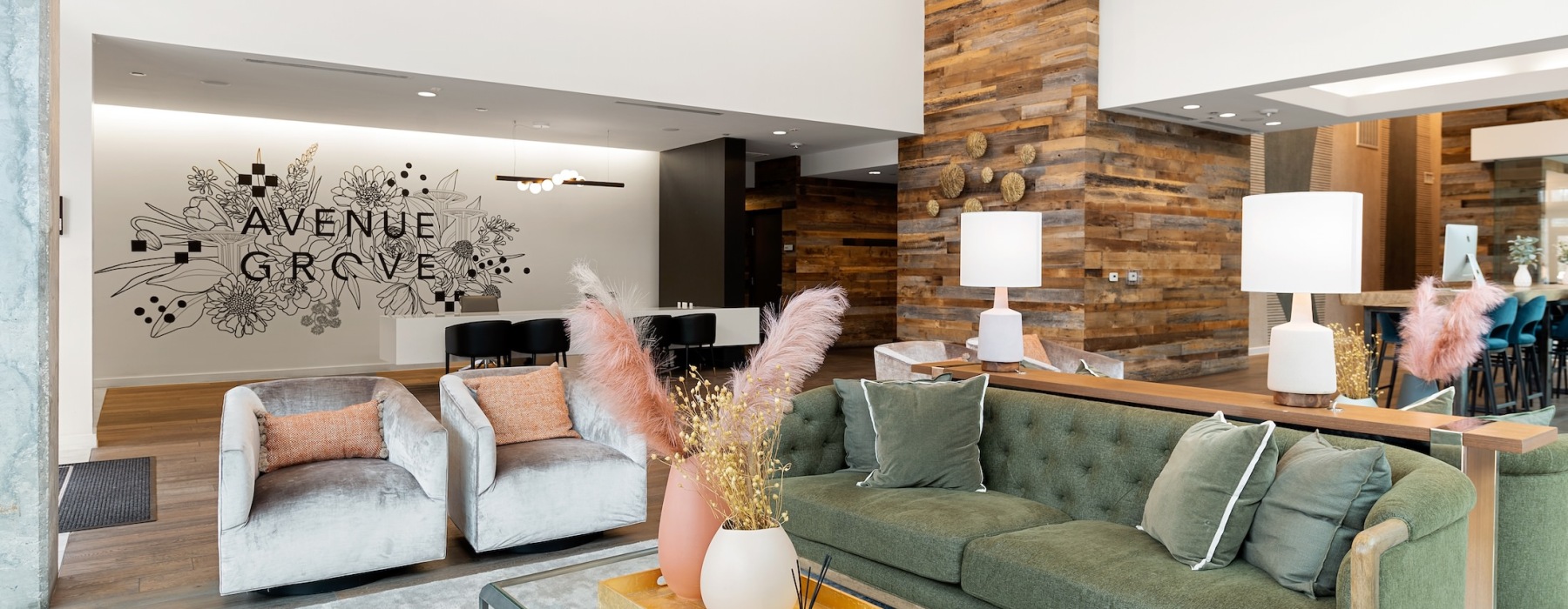 a spacious lounge with wall art