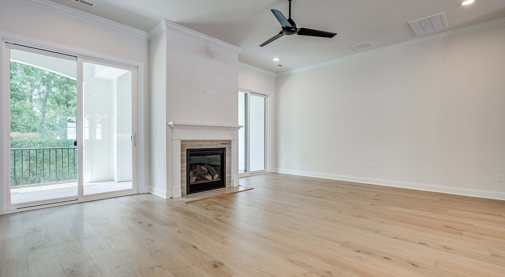 living room with wood flooring and a fireplace