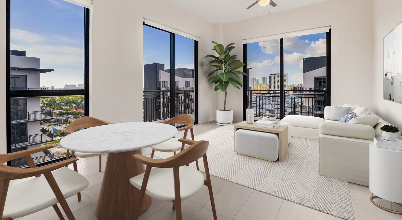 Spacious and well lit living room with wood floors and an open floor plan with access to the kitchen.