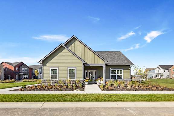 A house with a grey front yard and a grey roof.