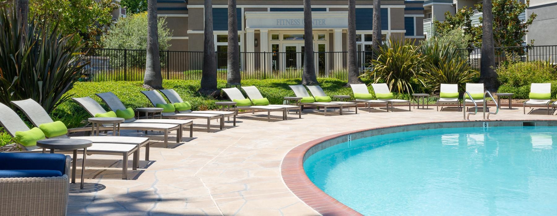 a pool with chairs around it
