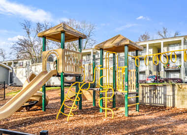 Large playground with slides and climbing area at Elliot Norcross Apartments