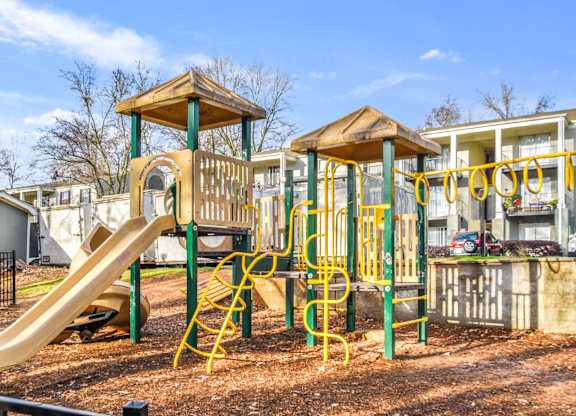 Large playground with slides and climbing area at Elliot Norcross Apartments