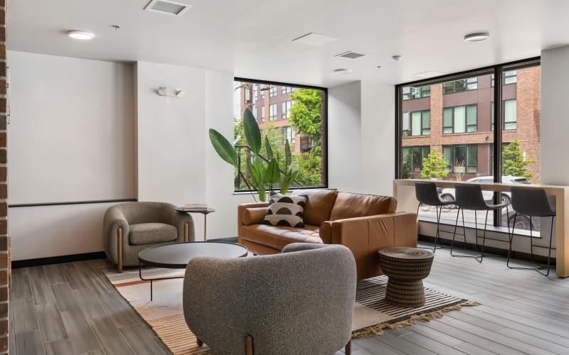 a living room with a couch and chairs