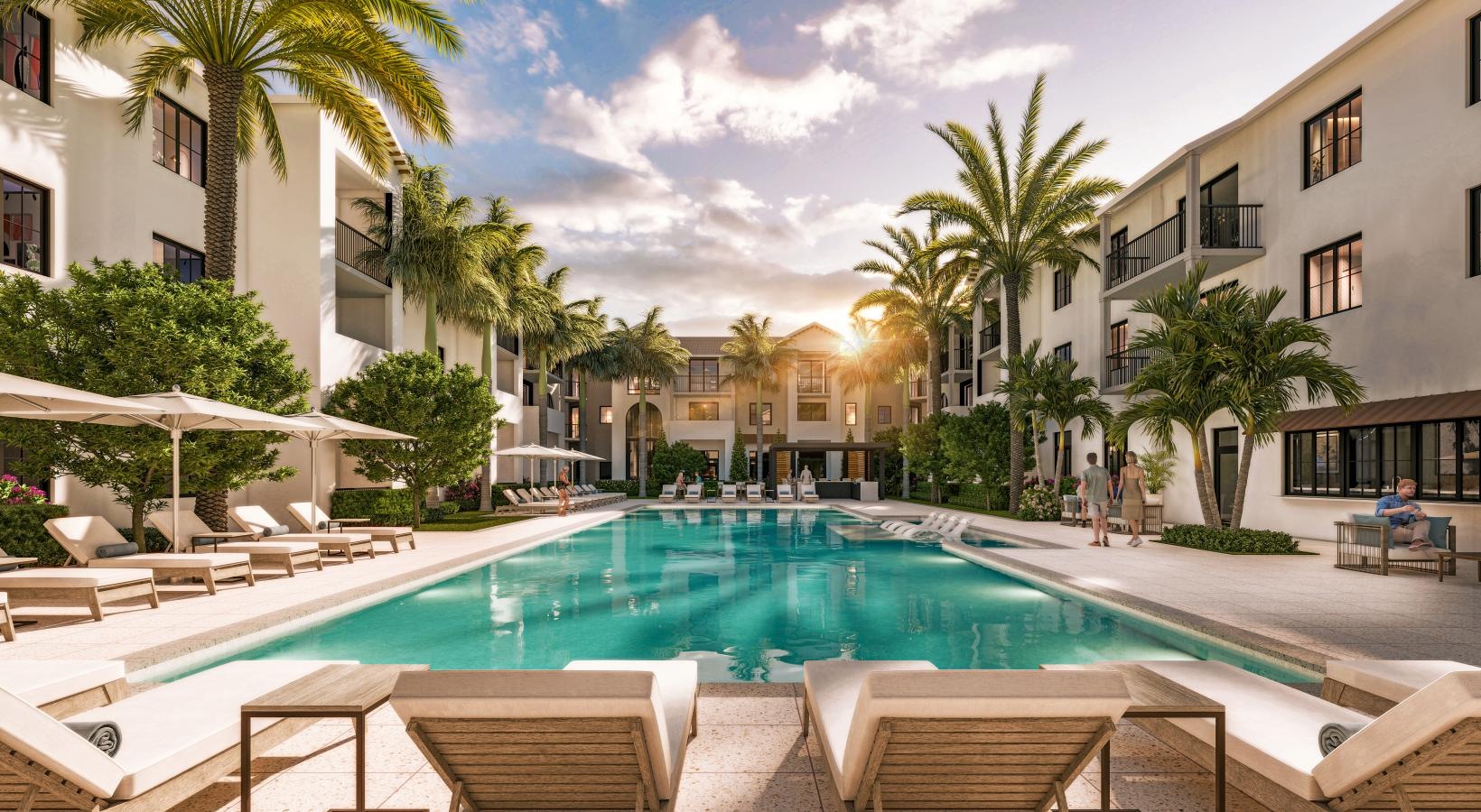 Pet-Friendly Senior Apartments in Boynton Beach, FL - Boynton Tropical - Resort Style Pool Courtyard With Palm Trees, Lounge Chairs, Shaded Umbrellas, And Modern Apartment Buildings At Sunset.