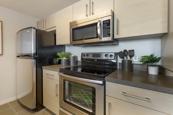a kitchen with stainless steel appliances and a microwave  at Vue, San Pedro, CA