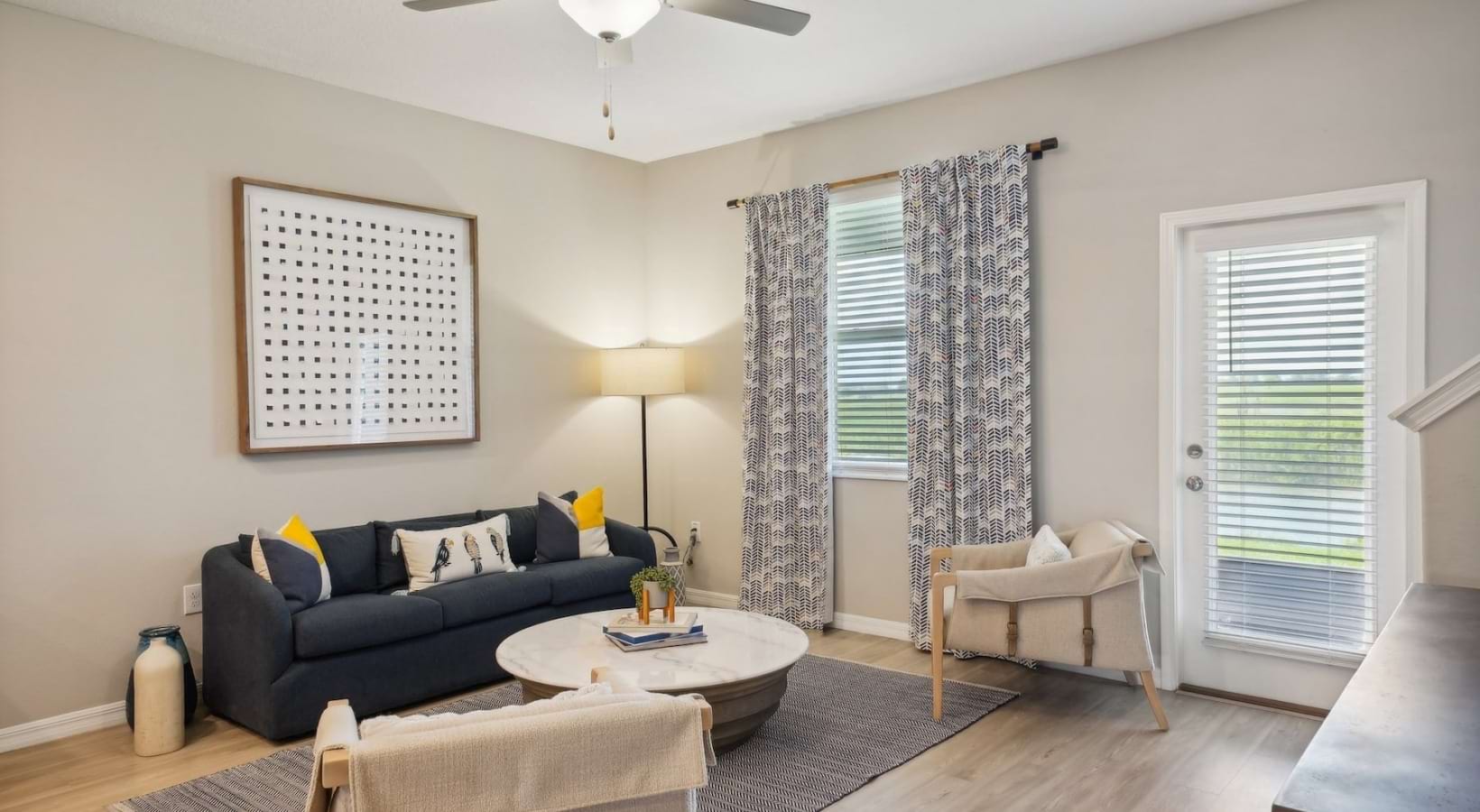 living area that includes ample seating spaces and bright lighting
