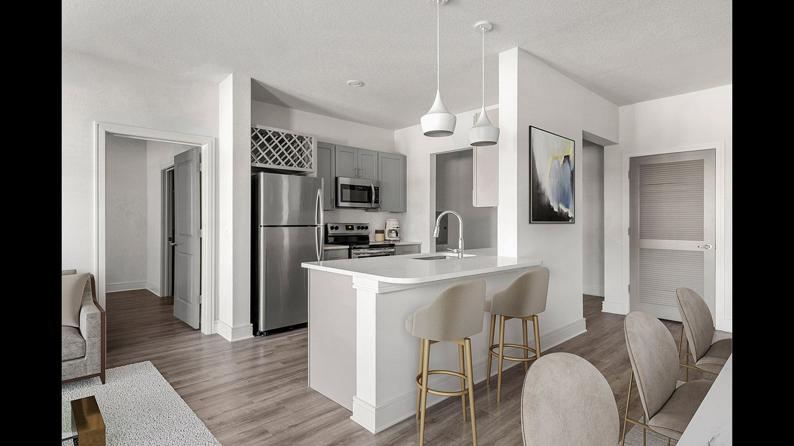 Elegant open-concept kitchen with modern stainless steel appliances, chic gray cabinets, and a stylish breakfast bar with pendant lighting.