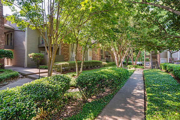 A tree-lined walkway in a residential area at Pear Orchard, Ridgeland, MS
