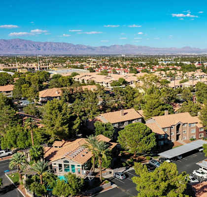 A bird's eye view of a residential area with houses and trees.
