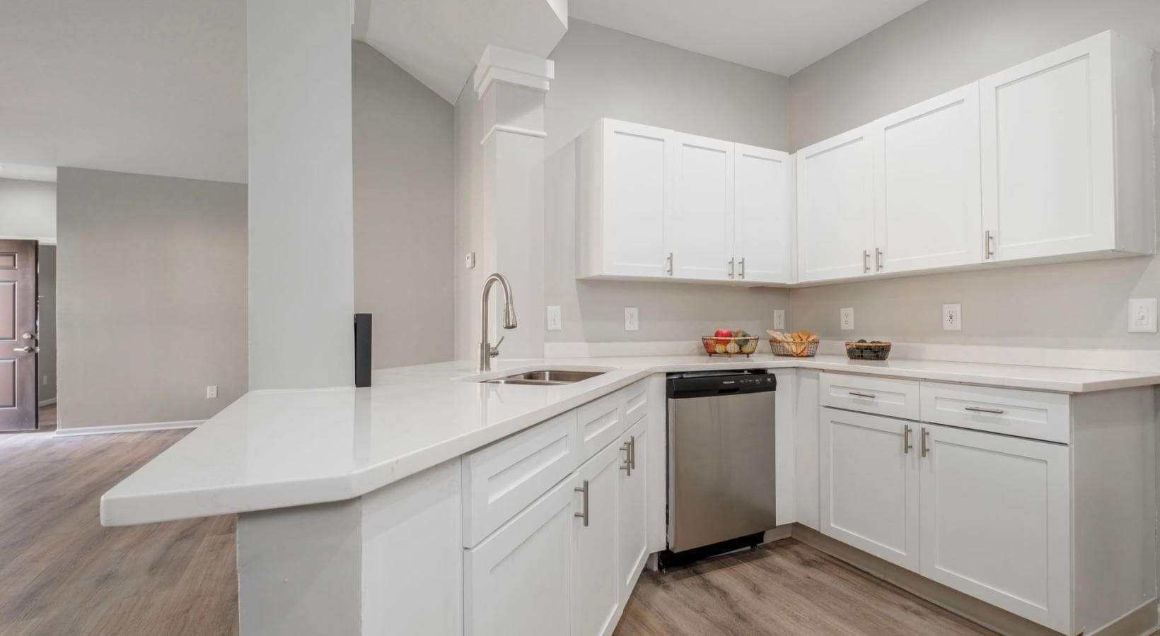 a kitchen with white cabinets